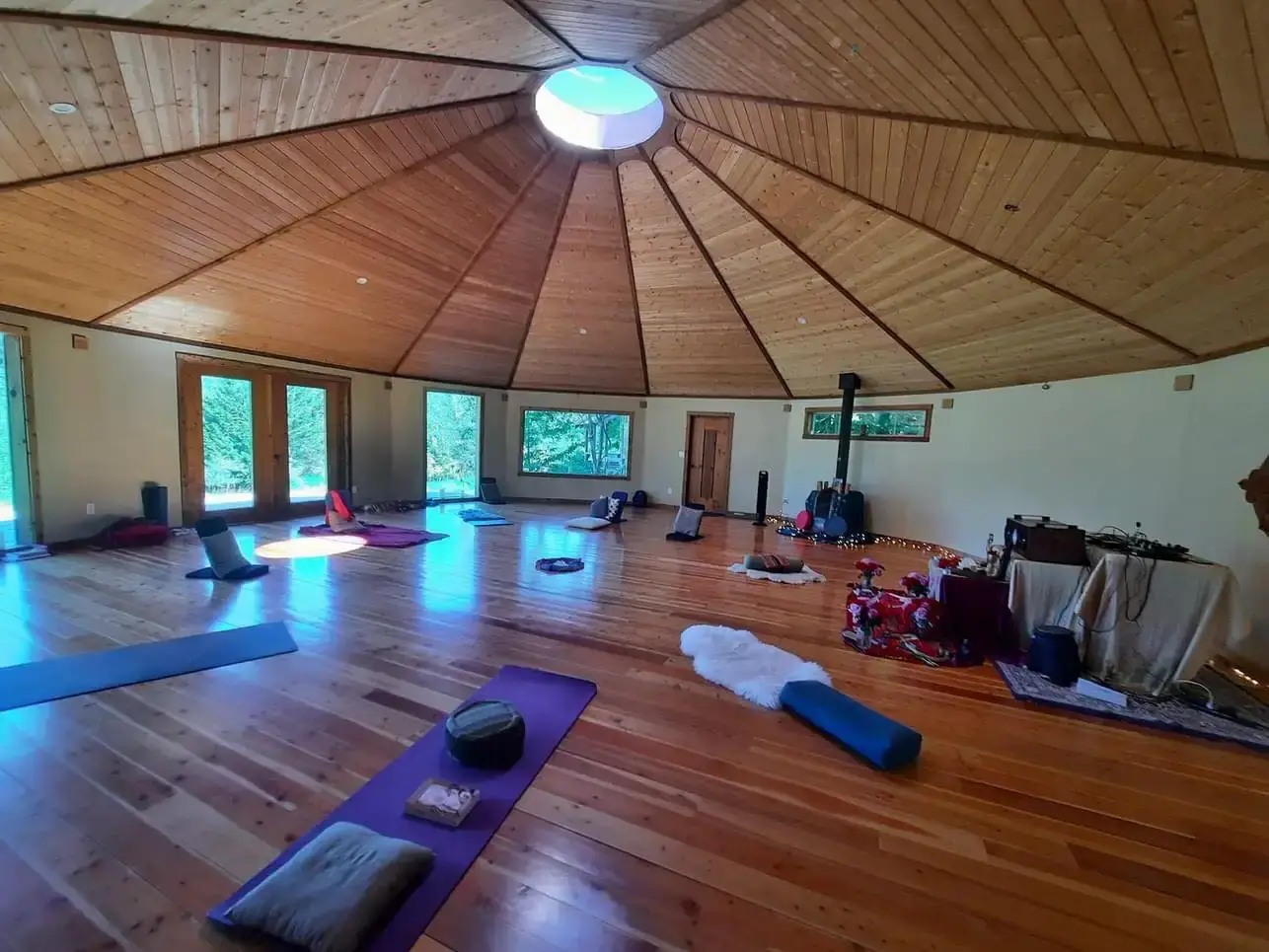 Spacious circular temple interior at Neptune Farm used for meditation and group practice